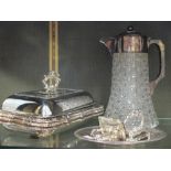 An electroplate mounted claret jug (stapled), three electroplate vegetable tureens and covers and an