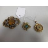 Three late 19th century brooches, one set with an oval citrine, the second set with a small rose cut