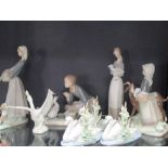 Seven Lladro figures, one of a lady with a goat, three with geese and lambs and three of a swan (7)