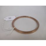 A 9ct slave bangle, (9g)