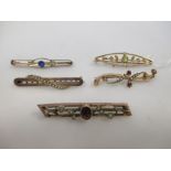 A 15ct peridot and pearl bar brooch, two 9ct garnet and pearl bar brooches, a 9ct seed pearl bar