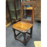 An early 18th century fruitwood back stool