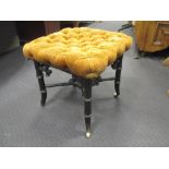 A Victorian faux bamboo ebonised footstool, 48cm high