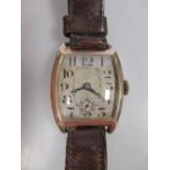 A gentleman's BWC 9ct cased wristwatch on brown leather strap (working, but requires a service)