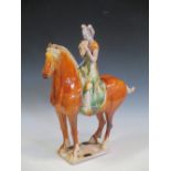 A Tang style model of a rider on a horse, 48 cm high