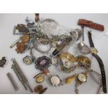 A 9ct cased ladies wristwatch and a quantity of other watches, costume jewellery and badges