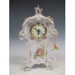 A Dresden floral decorated mantle clock, 34cm high, in working order with key