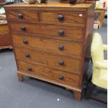 A tall 19th century chest of drawers with ebony stringing of two short and four long drawers,