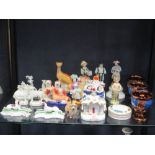 A collection of Staffordshire and other pottery animals, pastille burners etc.