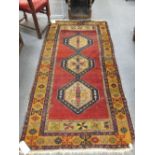 A Kazak rug, 122 x 238cm