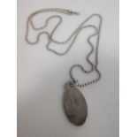 A Tiffany silver dog tag and chain