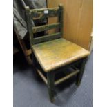 A late 18th century/early 19th century green painted childs chair