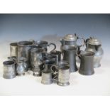 A Cork pewter mug by Munster Iron & Co, two pewter covered cider jugs and a collection of sixteen