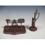 Brass postal scales and a carved bear angle measurer