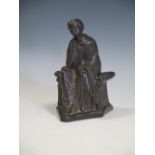 A small bronzed seated lady