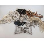 A box of late 19th century beaded trimmings for dresses including paste buckles and some jet