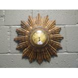 A Starburst wall clock, gilt wood surround and Japy Freres 20th century drum movement, 42cm diameter