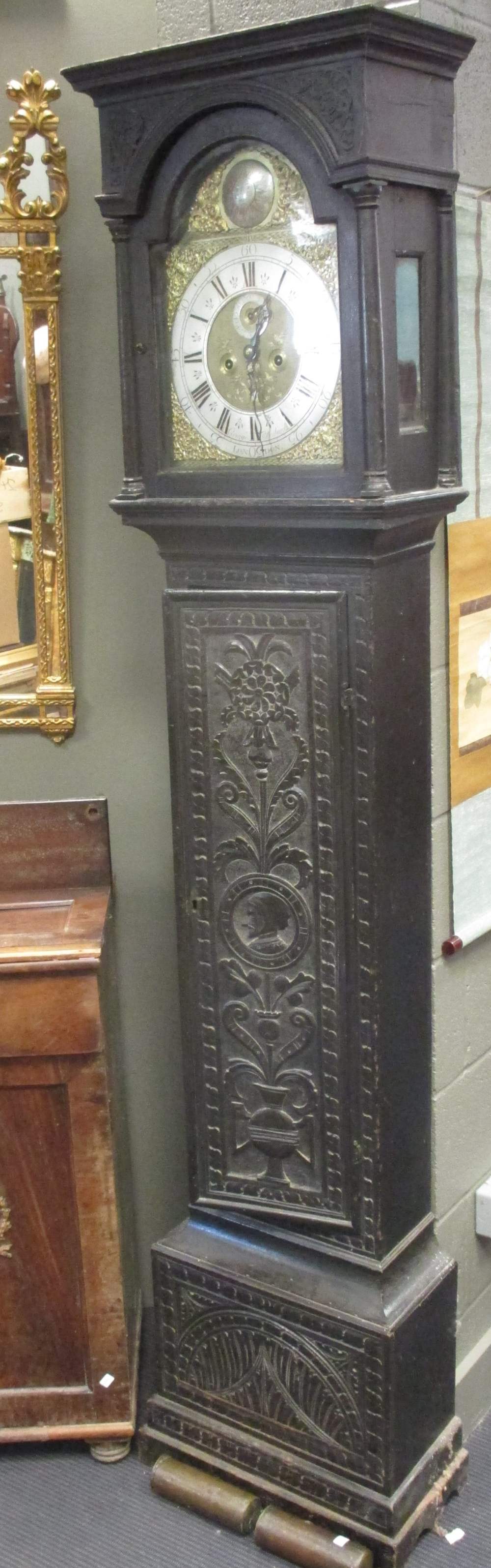 An 18th century oak longcase clock, George Thornburgh, London, with brass dial, later carved case,