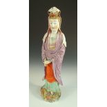 A later coloured 18th century blanc de Chine figure of Guanyin, 51cm (20 in) high Her head has