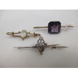 A diamond and pale blue hardstone bar brooch set in unmarked white and yellow precious metal