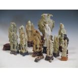 Eleven soapstone figures of immortals and a vase