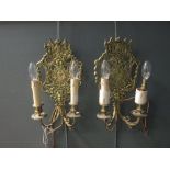 A set of three brass fire irons, and a pair of Louis XIV style gilt brass twin branch wall brackets