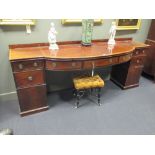 A late Georgian mahogany and crossbanded twin pedestal sideboard with bowfront central section, 85 x