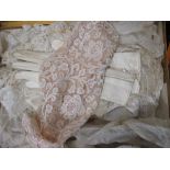 A quantity of textiles to include lace ware etc