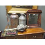 An Edwardian 'Hollands' shop display cabinet, coaching lamp and metal canisters