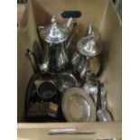 A quantity of silver to include a four piece dressing table set, a cigarette box, tongs and a