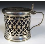 A Victorian pierced silver mustard with blue liner and a silver salt with pierced clover body and