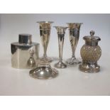 A silver tea cannister, a pair of small spill vases, a pepper grinder (6) etc