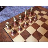 Cambon, King of Chess', a modern chess set, comprising turned wood pieces mounted with brass and