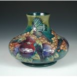 A modern Moorcroft Finch pattern vase, of compressed baluster form, painted and impressed marks,