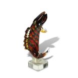 A Toso Murano glass model of a leaping fish, mounted to a clear base, signed to underside 39cm (