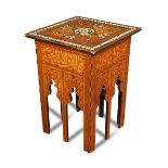 A Moorish style inlaid occasional table, inlaid with mother-of-pearl, ebony and specimen woods in