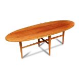 Gordon Russell of Broadway, an oval teak coffee table, raised on tapering legs united by cross-