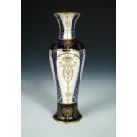 A Macintyre vase, circa 1910, the baluster form decorated in blue and gilt, printed marks 30cm (