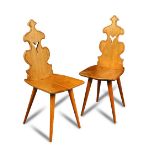 A pair of mid-century ash hall chairs, possibly Scandinavian, each with shaped pierced backs to