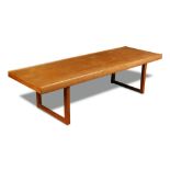 A large teak coffee table, the rectangular top with lipped edges raised on square legs 48 x 183 x