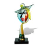 § Alessandro Barbaro for Murano, a Picasso style glass head, modelled wearing a hat, she rests