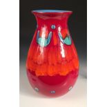 A large modern Poole pottery volcano vase, the bulbous body decorated in greens, blues, reds and