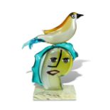 § Alessandro Barbaro for Murano, a Picasso style glass head, surmounted with a bird, mounted to a