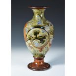 A Royal Doulton stoneware vase by Mark V. Marshall, the baluster form decorated with scrolling