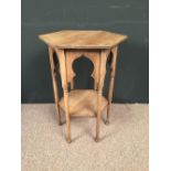 A Moorish occasional table, probably retailed by Liberty & Co., the hexagonal top raised on six