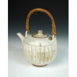 § David Leach (British, 1911-2005) a Lowerdown Pottery stoneware teapot and cover, cut sided with