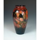 A Moorcroft Anemone pattern flambé vase, decorated to a mottled red into blue ground, painted and