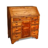 A fine Cotswold School solid walnut bureau, in the manner of Peter Waals, the fall front opening