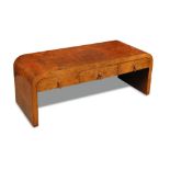 An Art Deco walnut coffee table, the rectangular top with rounded ends into solid supports with