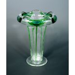 Attributed to Stuart & Sons, a Peacock glass vase, clear with applied green prunts with blue centres